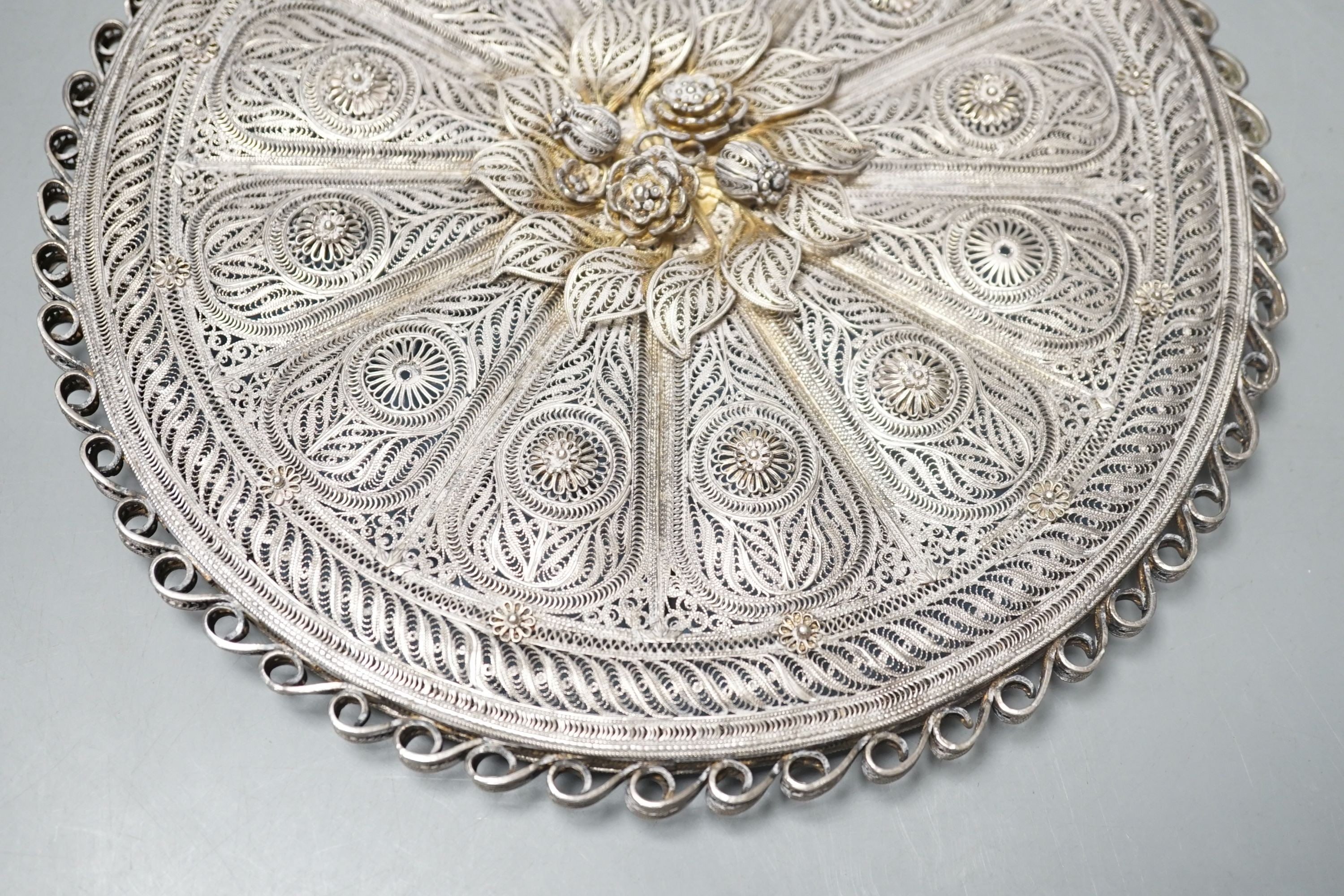 An Indian Goanese circular filigree work mirror, 23 cms diameter.